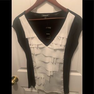 Black and white ruffle front top